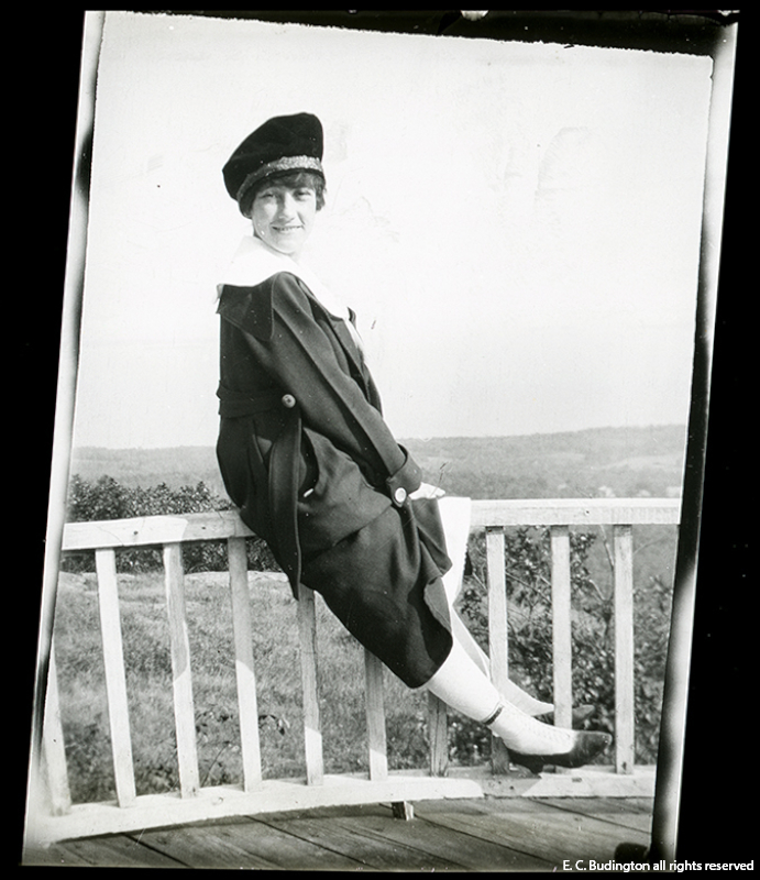Girl on Porch Rail