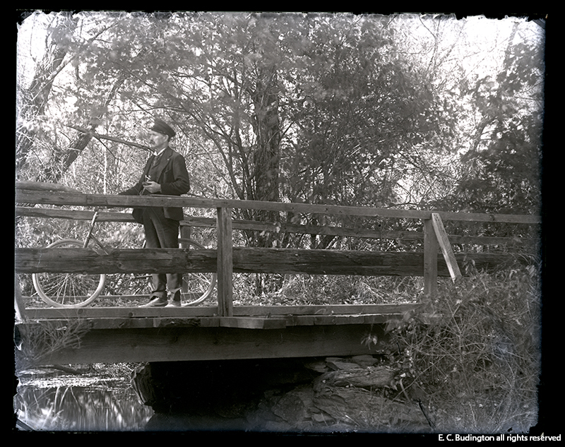 Man with Bike on Bridge